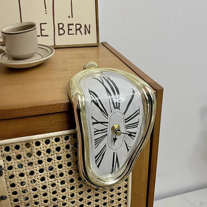 Surreal melting clock with roman numerals on wooden cabinet, modern home decor accent piece.