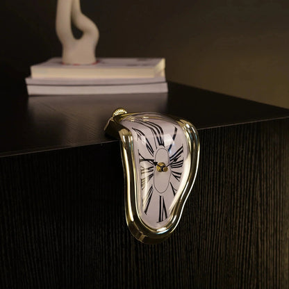 Surreal melting clock with gold trim draped over a black tabletop, modern home decor