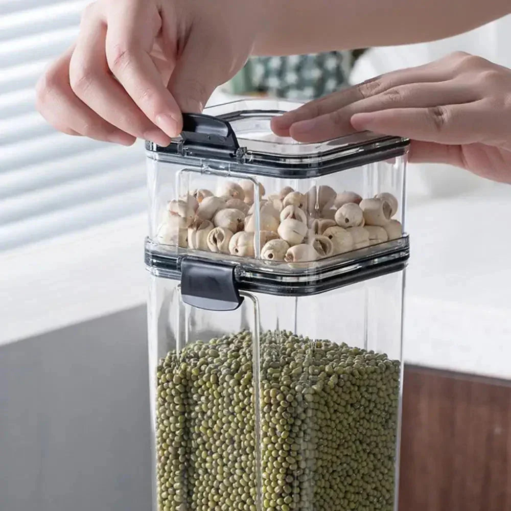 Hands opening a stackable airtight food storage container with beans and dried snacks inside